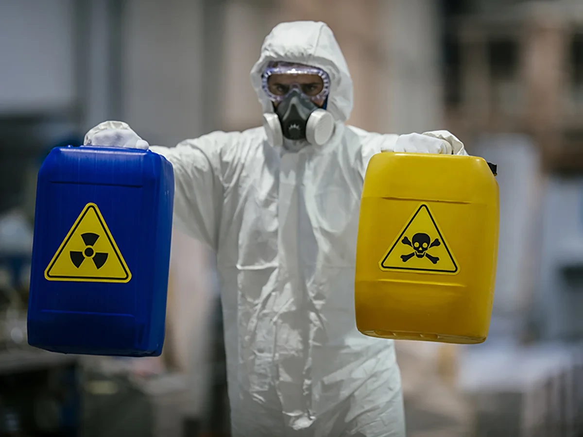 Biohazard cleanup technicians in protective equipment at a remediation scene in Ankeny, IA